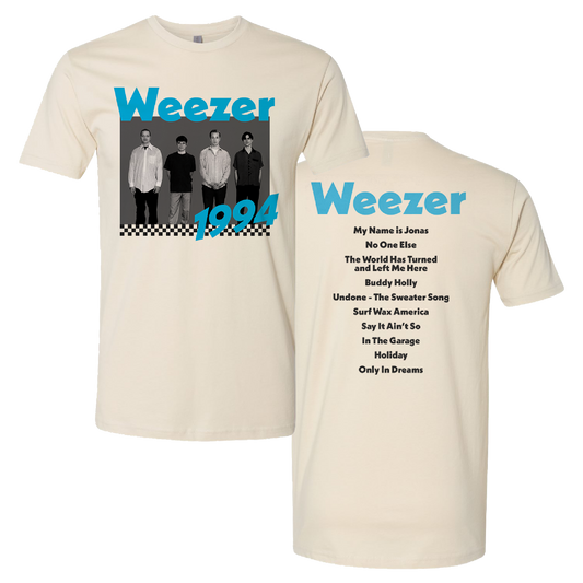 Cream-colored cotton t-shirt featuring a black-and-white photo of the band weezer from 1994 with teal lettering and a checkered border, along with track listings on the back.