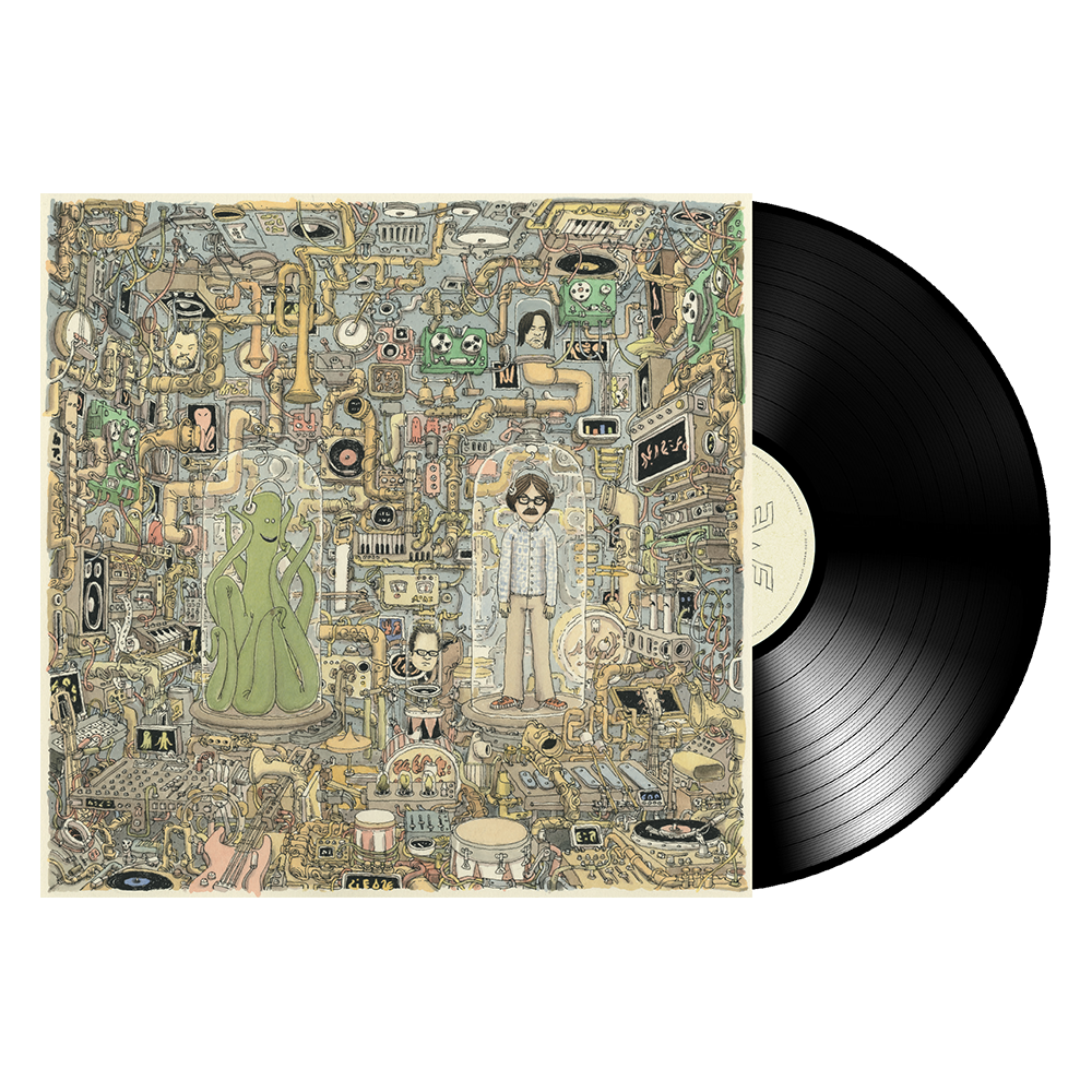 Black vinyl record with cream label resting beside detailed album cover for ok human black vinyl favorite songs collection