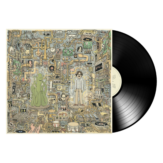 Black vinyl record with cream label resting beside detailed album cover for ok human black vinyl favorite songs collection